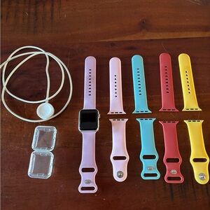 Apple Smartwatch with Pink, Blue, Red, and Yellow Bands